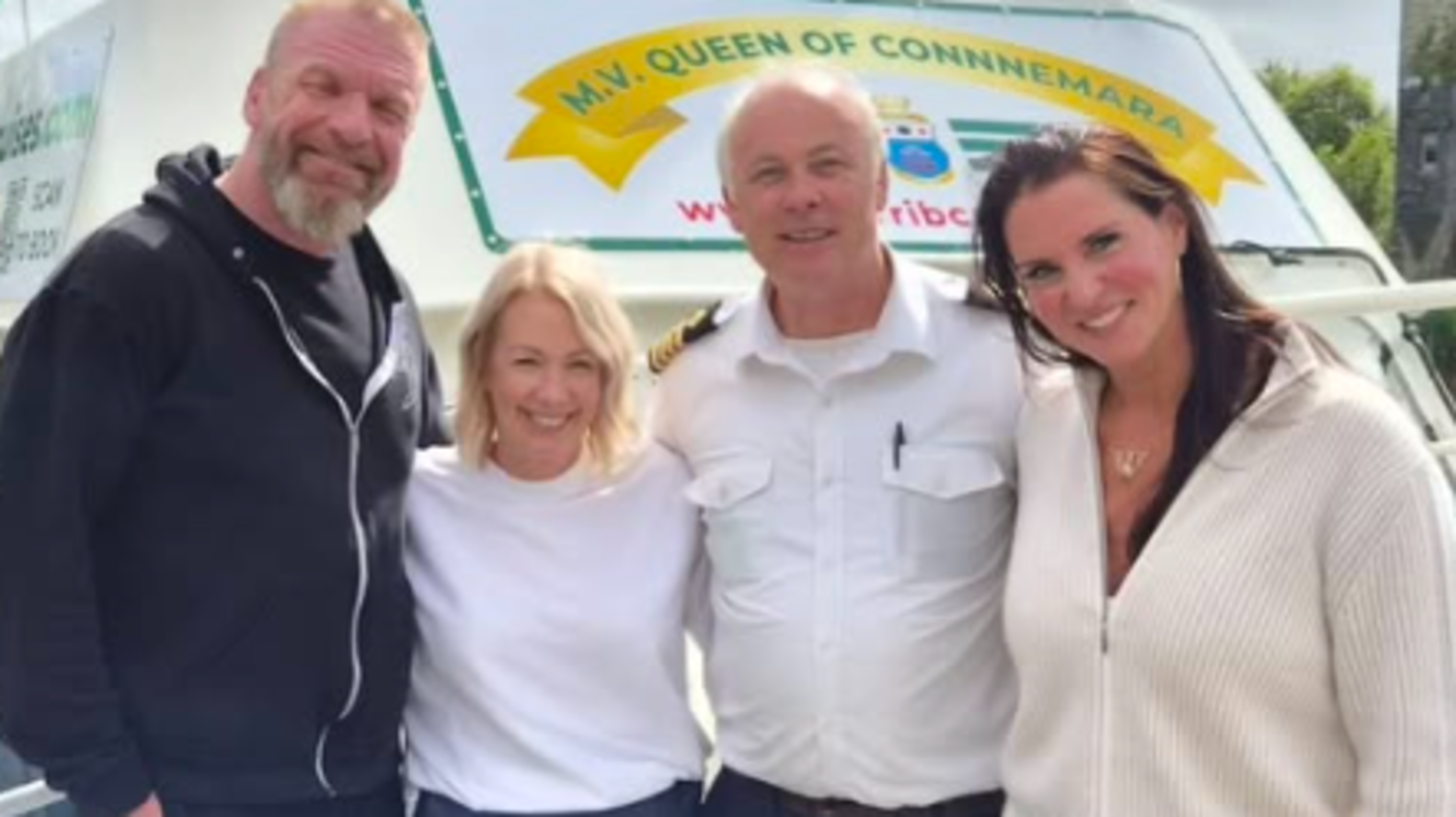 WWE star Triple H poses with Galway cruise staff during Ireland visit